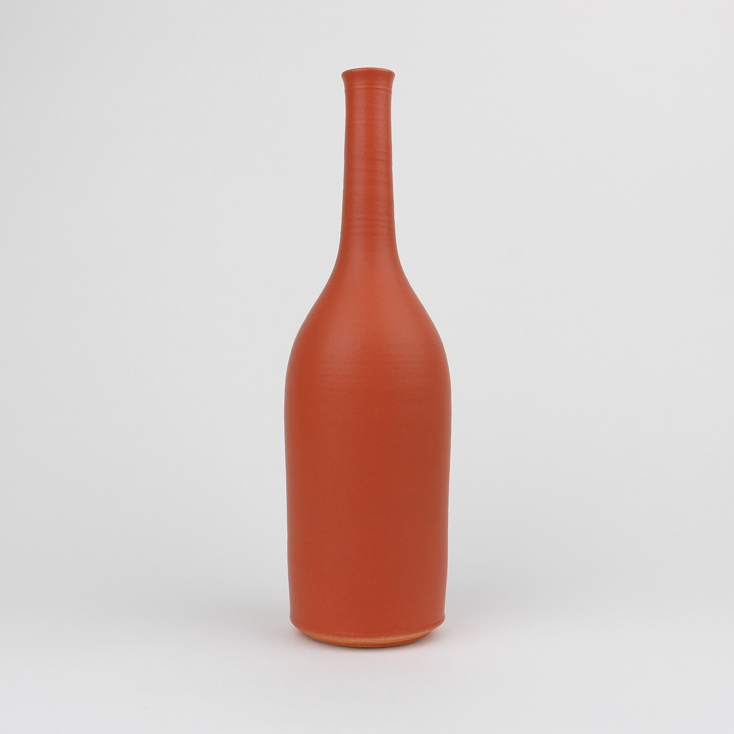 Bottle, burnt orange by Lucy Burley